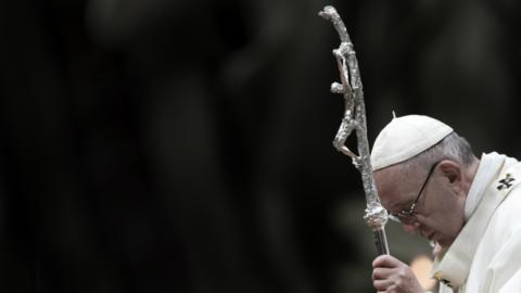 Pope Francis praying