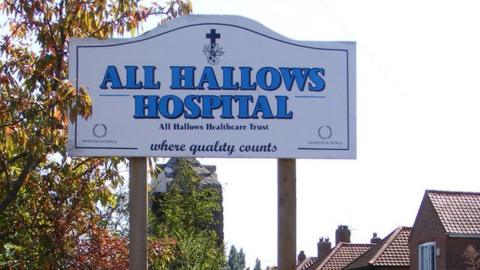 All Hallows Hospital sign