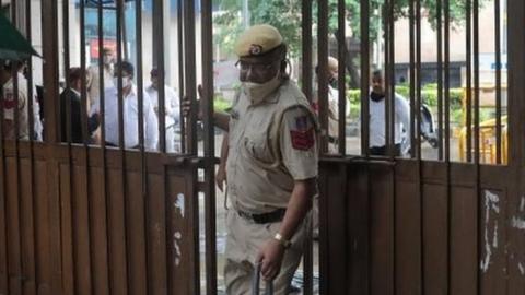 A police officer at the Rohini court after a shootout in New Delhi, India 24 September 2021.