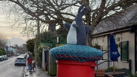 Post box topper of the Headington Shark