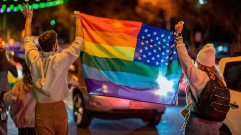 Pro-LGBT Biden supporters in West Hollywood celebrate his victory last year