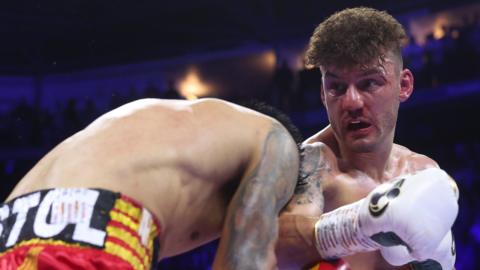 Leigh Wood swings a punch at Mauricio Lara in their world title fight in Nottingham