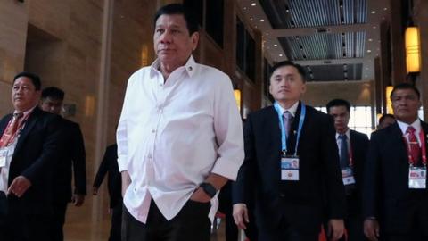 A handout picture released by the Presidential Photographers Division (PPD) shows Philippines President Rodrigo Duterte (centre, hands in pockets) walking to attend a meeting during the Association of Southeast Asian Nations (ASEAN) Summits at the National Convention Centre (NCC) in Vientiane, Laos, 6 September 2016.