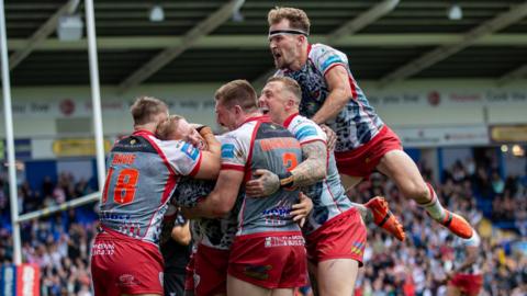 Leigh Leopards celebrate a try against St Helens