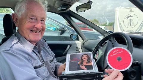 John Hemsworth with his Jane McDonald CD