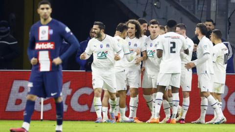 Marseille's players celebrate after scoring against Paris St-Germain in the French Cup