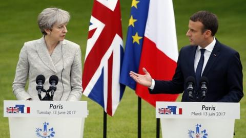 Theresa May and Emmanuel Macron at a joint news conference in Paris on 13 June 2017