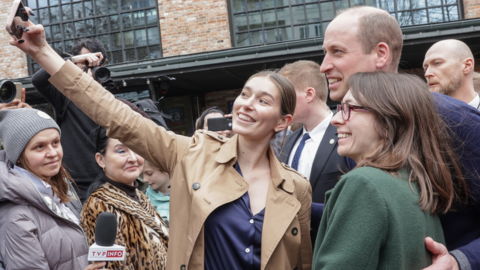 People taking selfies with Prince William