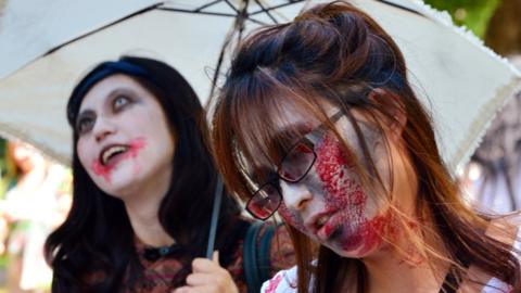 Participants take part in a 'zombie walk' at a park in Tokyo on May 17, 2014