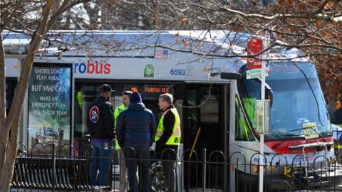 Photo of Washington DC police outside a Metro Bus as part of the investigation into Wednesday morning's shooting