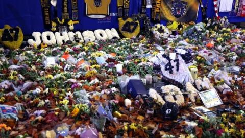 Floral tributes to Adam Johnson outside Nottingham's Motorpoint Arena