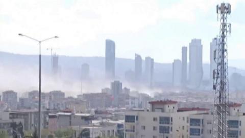 Smoke rising above buildings in Izmir