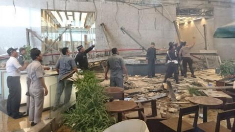 Staff inspect damage at the stock exchange