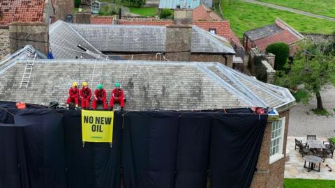 Greenpeace UK activists on the roof of British Prime Minister Rishi Sunak's home in Richmond, Yorkshire, Britain, on 3 August 2023