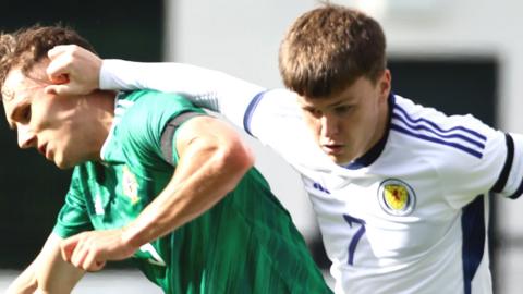 Scotland scorer Ben Doak holds off NI's Dane McCullough