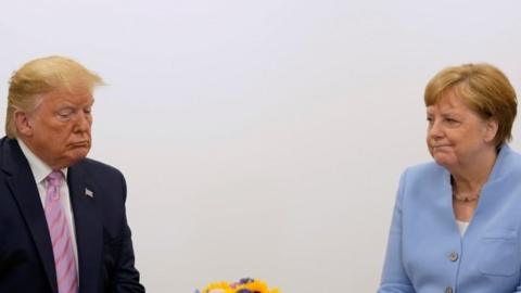 US President Donald Trump (left) and German Chancellor Angela Merkel at a G20 summit in Osaka, Japan. Photo: 28 June 2019