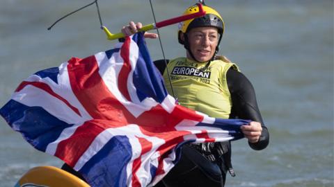 Ellie Aldridge holds a British flag