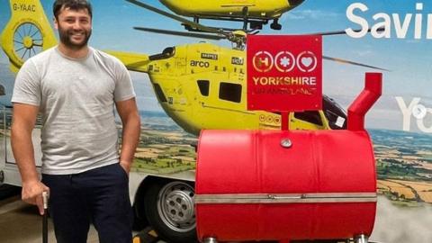 Ben Patel with a barbecue he made to be auctioned for the Yorkshire Air Ambulance