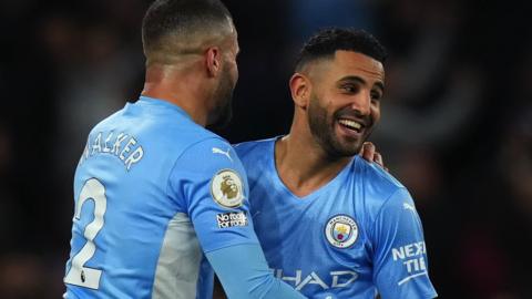Kyle Walker and Riyad Mahrez (right) celebrate a goal for Manchester City