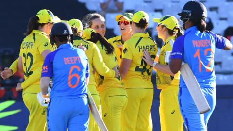 Australia celebrate beating India in the Women's T20 World Cup semi-final