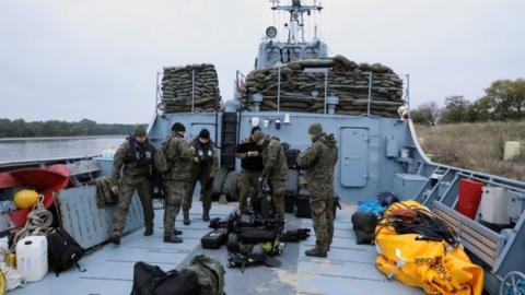 Navy divers from the 12th Minesweeper Squadron of the 8th Coastal Defense Flotilla take part in an operation to defuse the largest unexploded World War Two Tallboy bomb ever found in Poland, in Swinoujscie, Poland