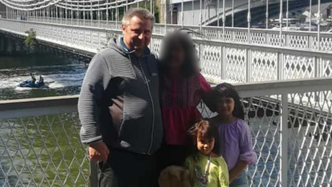 Bartlomiej Kuczynski, 45, a woman, 12-year-old-Jasmin Kuczynska, and Natasha Kuczynska, aged nine, near a river bridge