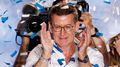 Spain's opposition People's Party leader Alberto Nunez Feijoo applauds during the general election, in Madrid, Spain, July 24, 2023