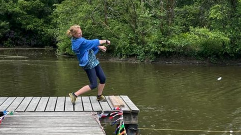Christina mid throw at the Welsh stone skimming championships