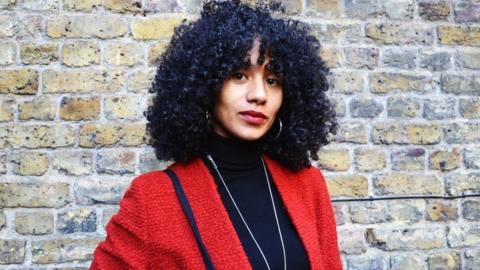 Girl with afro and hooped earrings