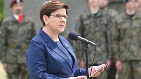 Polish Prime Minister Beata Szydlo speaks next to the Lagerhaus building near the former Nazi-German Concentration camp Auschwitz I in Oswiecim, Poland (14 June 2017)