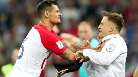 Croatia's Lovren grabbed pitch invader Pyotr Verzilov, 15 Jul 18