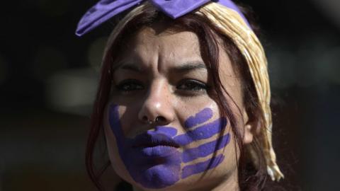 A woman takes part in a protest on the International Day for the Elimination of Violence against Women in Buenos Aires on 25 November, 2019.