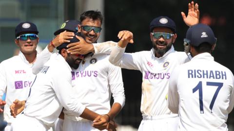 India celebrate after taking wicket against England in Chennai