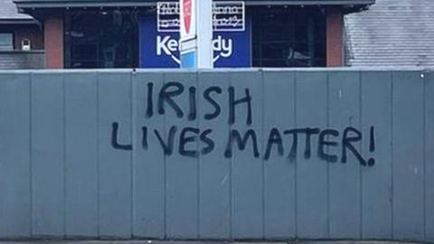 Graffiti reading Irish lives matter at the Kennedy Centre on the Falls Road