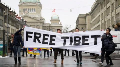 Pro-Tibet protestors hold a banner reading "Free Tibet" during a demonstration, prior to the state visit of Chinese President Xi Jinping in Bern, Switzerland, 15 January 2017.