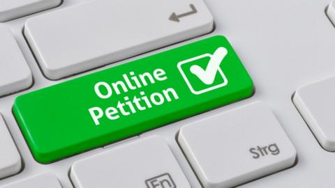 A-computer-key-that-says-online-petition.
