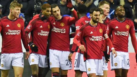 Manchester United players celebrate a goal