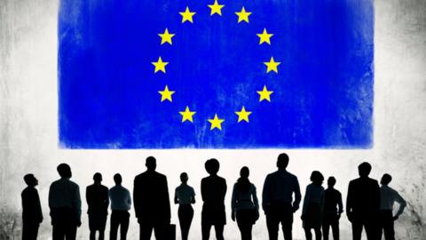 EU flag and businesspeople