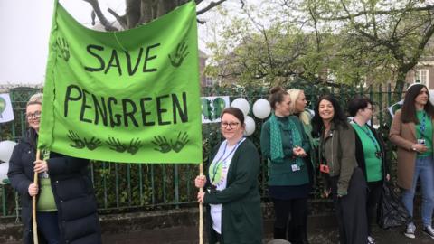 Pen Green nursery protest, parents and people holding a banner