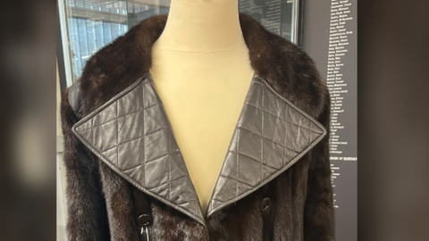 A photo of the mink leather coat on a mannequin