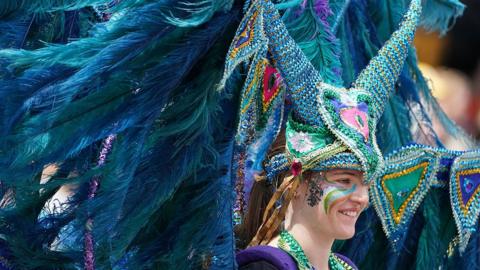 Performers from Edinburgh Festival Carnival parade entertain the crowds in Princes Street Gardens in Edinburgh during a Platinum Jubilee event on day four of the Platinum Jubilee celebrations.