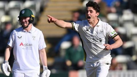 Tom Price celebrates taking a wicket for Gloucestershire against Worcestershire