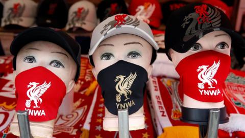 A market stall displays Liverpool FC face masks