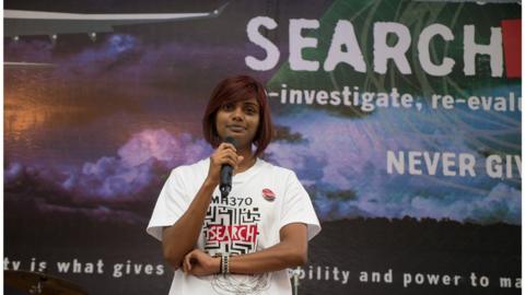 Grace Subathirai Nathan speaking at an event two years after the plane went missing.