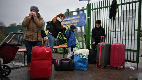 Refugees and volunteers are seen at Medyka border crossing between Poland and Ukraine