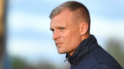 Oxford United boss Liam Manning on the sideline during a League One game