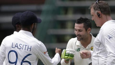 South Africa's Dean Elgar fist pumps the Sri Lanka players at the end of the second Test