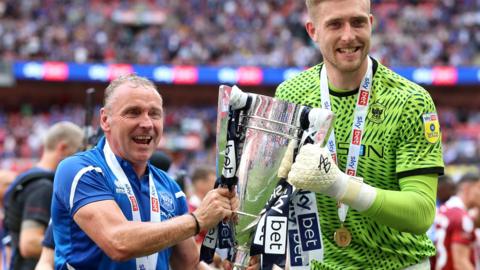 Paul Simpson and Tomas Holy with the League Two play-off trophy