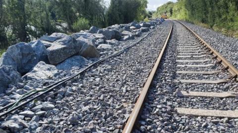 Rock armour boulders protecting a section of track on the Conwy Valley Line