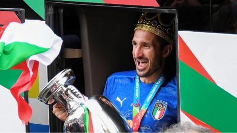 Italian football Captain Giorgio Chiellini steps off bus with trophy